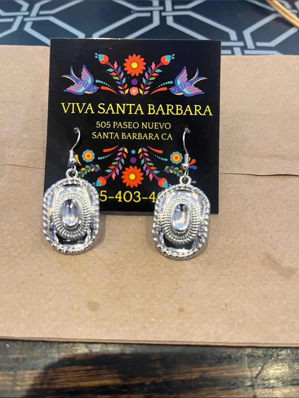 Small cowboy earrings silver color